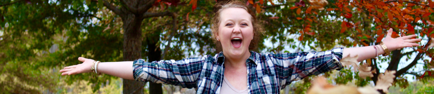 Happy young teenage girl outside in fall