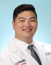 Photo of Alex Gu, MD, in white lab coat