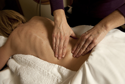 Patient with back pain receiving a lower back pain treatment
